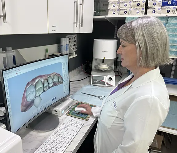 Dental team member using advanced dental technology