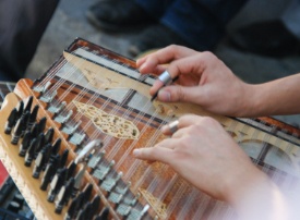 Doctor Bassily playing a qanun