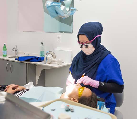 Dentist treating dental patient