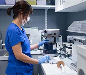 Dental team member using advanced dental technology