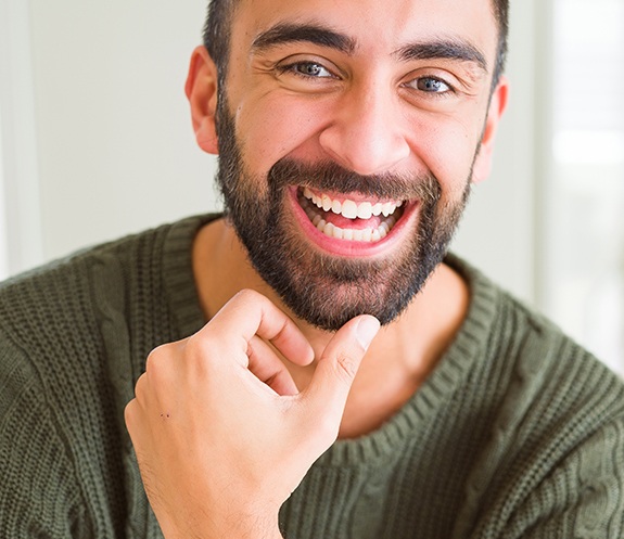 Man with flawless healthy smile after Chao Pinhole Surgical technique treatment