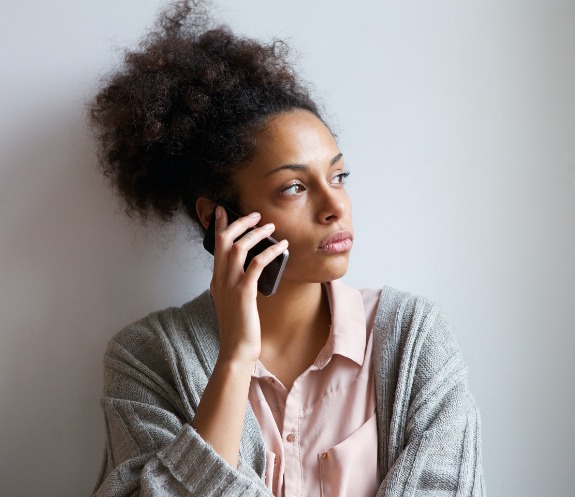 Woman discussing how to handle dental emergencies with dentist