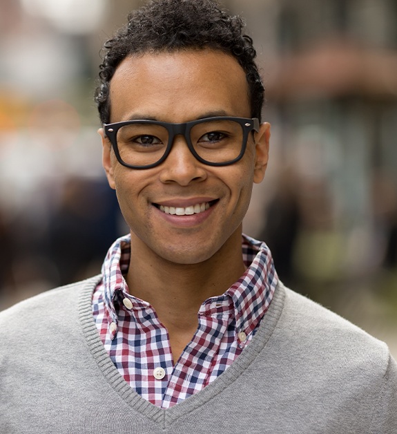 Man sharing healthy smile after receiving inlays and onlays