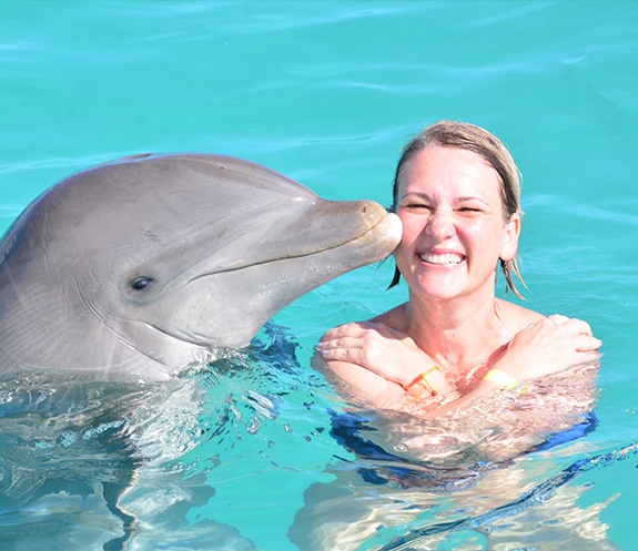 Doctor Obholz swimming with dolphins