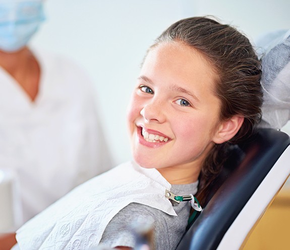 Child smiling after receiving dental sealants