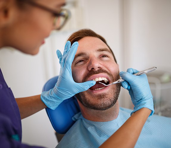 Patient receiving oral cancer screening