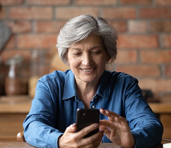 Woman scheduling cosmetic dentistry consultation