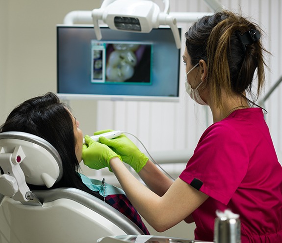 Dentist using intraoral camera to capture smile photos