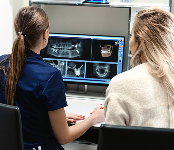 Dental team members reviewing digital x-rays