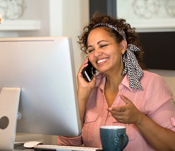 Woman calling dental office to schedule an appointment