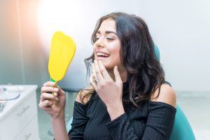 woman in dental chair smiling