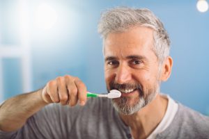 Brushing as recommended by a dentist in Friendship Heights