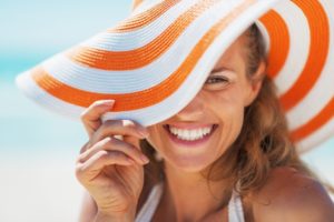 a woman smiling on the beach