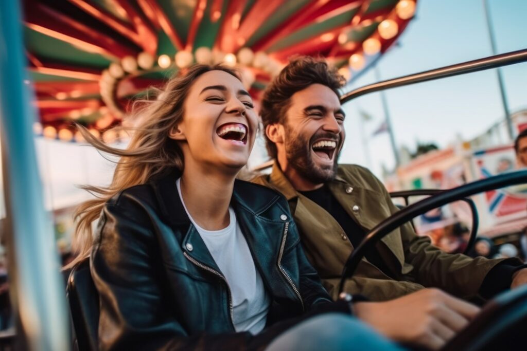Couple smiling while on ride at fair